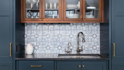 Blue kitchen cabinets with sink