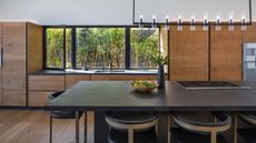 black kitchen countertop ideas modern wood and black kitchen with black countertops and island top, crittall windows, black lighting,