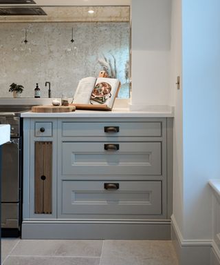 grey kitchen with base molding