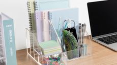 Desk with clear desk organizer and notebooks