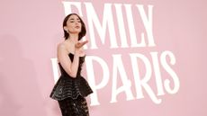 Lily Collins against pink background