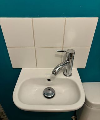 small white basin with monobloc tap