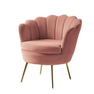 A dusky pink accent chair with a scalloped back and gold legs